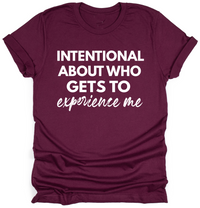 Maroon t-shirt with white text on a white background