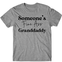 Gray t-shirt with black text 'Someone's Fine Ass Granddaddy' on a white background